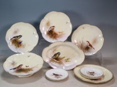 A Royal Worcester part Dessert Service, painter E. Barker, depicting species of Birds in landscapes,