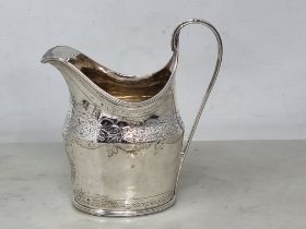 A George V silver oval Milk Jug with engraved frieze and initials, reeded rim, London 1797, maker: