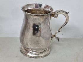 A George III baluster Pint Mug with leafage scroll handle, London 1773, maker: T.W, 365gms