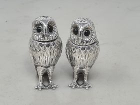 An Elizabeth II silver Salt and Pepper in the form of Owls with glass eyes, Birmingham hallmarks,