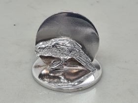 A George V silver Name Place Holder in the form of a bird on a circular base, Chester 1913, maker: S