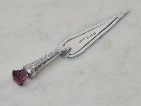 An Edward VII silver Trowel Book Mark with engraved handle and amethyst glass finial, Birmingham