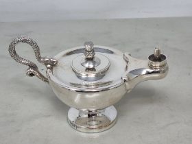 A George V silver Genie Table Lighter with serpent handle and thistle finial on pedestal base,