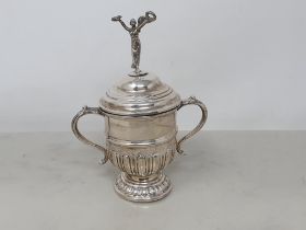 A George V silver two handled Trophy and Cover with figure finial, Birmingham 1920, 142gms