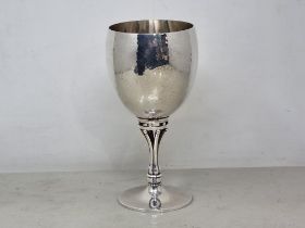 A Danish silver Goblet with hammered design on pierced designer stem and circular base, 6 1/2in,