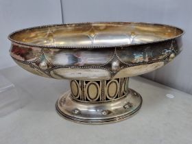 A Continental white metal oval Bowl with beaded rim and friezes, on pierced pedestal base with