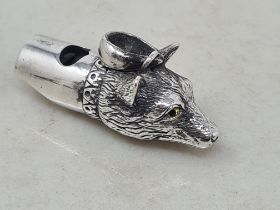 A sterling silver Whistle in the form of a fox mask with glass eyes