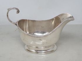 A George V silver Sauce Boat with reeded rim and scroll handle, Birmingham 1914, 100gms