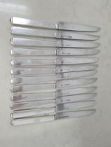 A Set of twelve 19th century French silver handled Dinner Knives engraved with coat of arms (thought