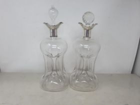 A pair of Edward VII silver mounted dimple Decanters with double pouring lips, London 1905,odd