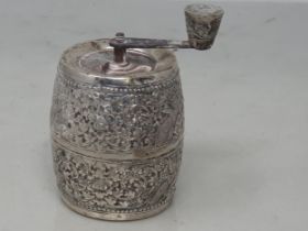 A Chinese silver barrel shape Pepper Mill with figure and scroll embossing