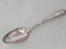 A George III silver Table Spoon old english pattern with feather edge, engraved initials, London