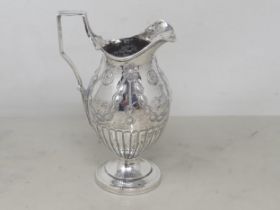 An Edward VII silver Jug decorated floral swags on circular base, Birmingham 1908, 112gms