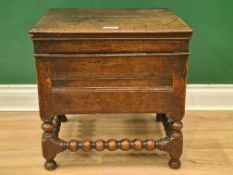 A Charles II oak Box Stool with hinged lid having iron butterfly hinges, on bobbin turned and square