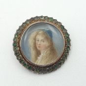 An 18th century Portrait Miniature Brooch in an unmarked frame set mixed-cut emeralds, Kee