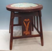 An Arts and Crafts Stool in the manner of Liberty with circular inset upholstered seat, raised on