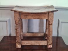 A Mouseman carved oak Stool, the dished burr oak top above tapered octagonal legs with a mouse,