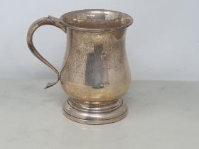 A George V silver baluster Pint Mug with scroll handle, Birmingham 1933, 350gms