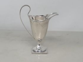 A George V silver helmet shape Jug on square base, Birmingham 1925, 80gms
