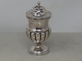 A George III silver Pepperette, gadroon embossed on circular base, London 1819, 50gms
