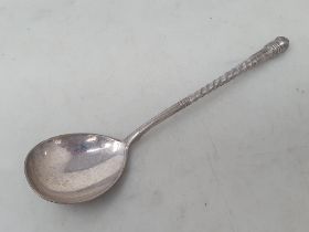 A Russian silver Spoon with floral engraving and initials to the reverse of the bowl, spiral stem