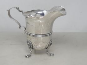 An Edward VII silver Jug with shaped rim on lion mask and paw feet, London 1903, 210gms