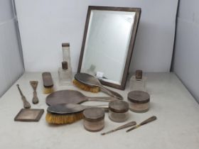 A matched silver mounted Dressing Table Set with engine turned decoration, London 1934/5/7/45/6,etc.