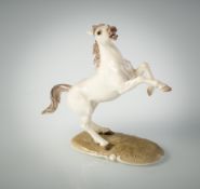 A NYMPHENBURG FIGURE OF A RISING HORSE