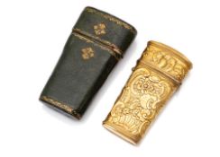 A FINE CHASED BRASS ROCOCO TRAVELLERS SEWING CASE WITH LEATHER BOX