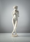 A BISCUIT PORCELAIN FIGURE OF A FEMALE NUDE - 