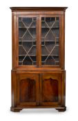 A BRASS MOUNTED MAHOGANY CORNER DISPLAY CUPBOARD