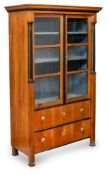 A GERMAN BIEDERMEIER BRASS MOUNTED PARTIALLY EBONIZED CHERRYWOOD DISPLAY CUPBOARD