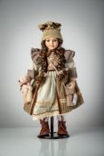 A PORCELAIN HEAD DOLL
