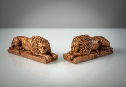 A PAIR OF ROSSO DI VERONA MARBLE LIONS