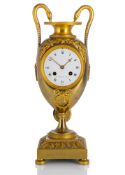 A VASE SHAPED BRONZE NEOCLASSICAL PENDULE