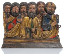 A LATE MEDIEVAL POLYCHROME PAINTED AND GILT RELIEF CARVING OF THE LAST SUPPER