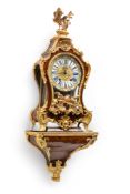 A SWISS BRONZE MOUNTED KINGWOOD PENDULE CONSOLE