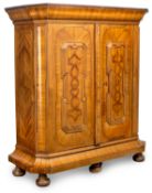 A SOUTH GERMAN BAROQUE WALNUT, FRUITWOOD AND BOG OAK PARQUETRY CUPBOARD