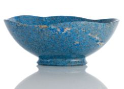 AN OVAL BLUE STONE BOWL