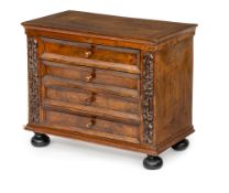 AN ITALIAN WALNUT AND EBONIZED MINIATURE COMMODE