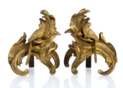 A PAIR OF LOUIS XV ORMOLU FIRE DOGS