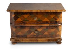 A SOUTH GERMAN WALNUT PARQUETRY MINIATURE COMMODE