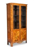 A LOUIS XVI ORMOLU-MOUNTED KINGWOOD; AMARANTH AND FRUITWOOD MARQUETRY LIBRARY BOOKCASE
