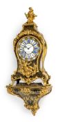 A FINE LOUIS XV ORMOLU MOUNTED BOULLE PENDULE AND WALL BRACKET