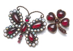 A FOUR-LEAF CLOVER BROOCH AND A BUTTERFLY BROOCH