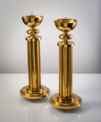 A LARGE PAIR OF BRASS ALTAR CANDLESTICKS