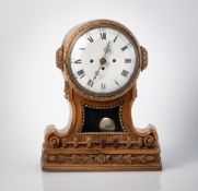 A GERMAN CARVED WOOD MANTLE CLOCK