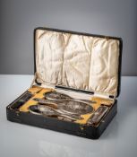 AN ENGLISH TORTOISE SHELL AND SILVER BRUSH TOILETTE SET WITH ORIGINAL CASE