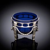 A NORTH GERMAN OPENWORK SILVER SALT CELLAR WITH BLUE GLASS LINER