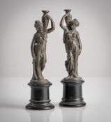 TWO WATER CARRIER FIGURINES
